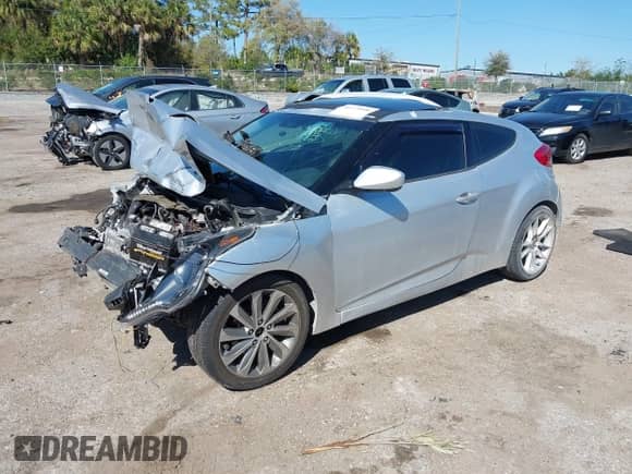 2012 Hyundai Veloster w/Black Int z VIN KMHTC6ADXCU036070, wystawiony jako IAAI lot #41779990 z przebiegiem Nie podano mil oraz . Historia ofert i sprzedaży dostępna na DreamBid. Obrazek 2.