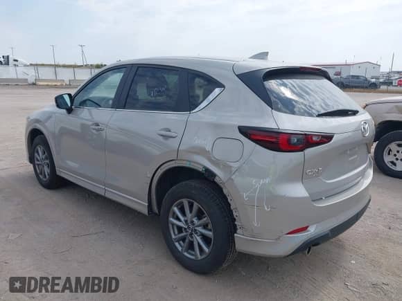 2025 Mazda CX-5 S Select z VIN JM3KFBBL4S0638918, wystawiony jako IAAI lot #43185428 z przebiegiem 9 817 mil mil oraz . Historia ofert i sprzedaży dostępna na DreamBid. Obrazek 3.