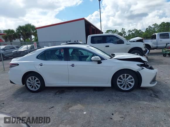 2021 Toyota Camry LE with VIN 4T1C11AK8MU601313, listed as a IAAI auction lot 43383218 with 34,384 mi miles and . Bid and sale history available at DreamBid. Image 13.