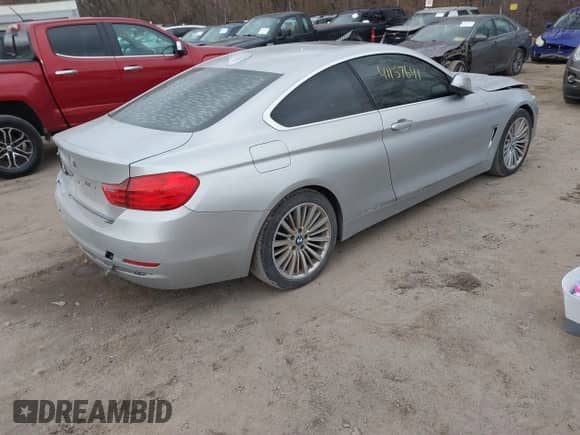 2014 BMW 4 Series 428i xDrive with VIN WBA3N5C53EF716542, listed as a IAAI auction lot 41157641 with 135,264 mi miles and . Bid and sale history available at DreamBid. Image 4.