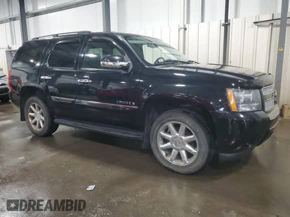 2008 Chevrolet Tahoe LTZ with VIN 1GNFK13058J117995, listed as a Copart auction lot 71724855 with 225,729 mi miles and Salvage title. Bid and sale history available at DreamBid. Image 4.