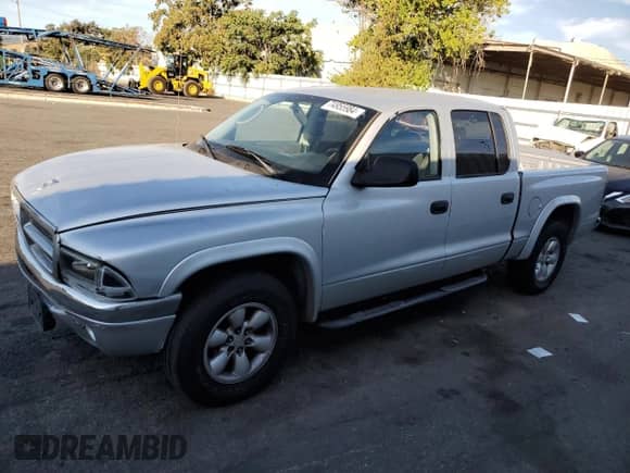 2004 Dodge Dakota Sport z VIN 1D7HL38N44S573883, wystawiony jako Copart lot #74955984 z przebiegiem 165 510 mil mil oraz Szkoda całkowita • Salvage title. Historia ofert i sprzedaży dostępna na DreamBid. Obrazek 1.