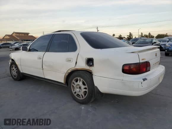 1995 Toyota Camry XLE с VIN JT2GK13E8S0123840, выставлен на аукционе Copart как лот 86379784 с пробегом 276 387 миль миль и Списание • Salvage title. История ставок и продаж доступна на DreamBid. Изображение 3.