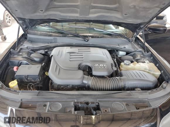 2013 Chrysler 300 S z VIN 2C3CCABG4DH561487, wystawiony jako Copart lot #68674885 z przebiegiem 148 604 mil mil oraz Szkoda całkowita • Salvage title. Historia ofert i sprzedaży dostępna na DreamBid. Obrazek 11.