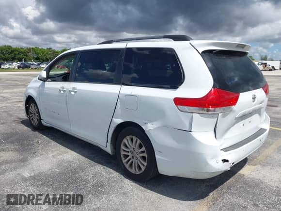 2014 Toyota Sienna XLE with VIN 5TDYK3DC4ES414728, listed as a IAAI auction lot 42588916 with 291,007 mi miles and . Bid and sale history available at DreamBid. Image 3.