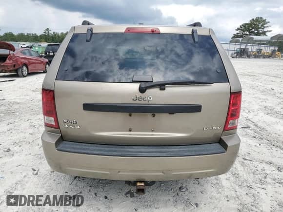 2005 Jeep Grand Cherokee Laredo z VIN 1J4HR48NX5C727601, wystawiony jako Copart lot #70047965 z przebiegiem 160 970 mil mil oraz Czysty tytuł • Clean title. Historia ofert i sprzedaży dostępna na DreamBid. Obrazek 6.