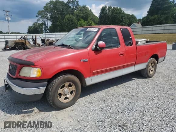 2001 Ford F-150 XL with VIN 1FTZX17261NB60758, listed as a Copart auction lot 66916165 with 191,444 mi miles and Salvage title. Bid and sale history available at DreamBid. Image 1.