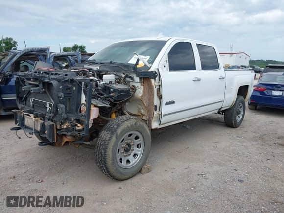 2016 Chevrolet Silverado 2500HD High Country z VIN 1GC1KXE84GF108635, wystawiony jako IAAI lot #42577059 z przebiegiem Nie podano mil oraz . Historia ofert i sprzedaży dostępna na DreamBid. Obrazek 2.