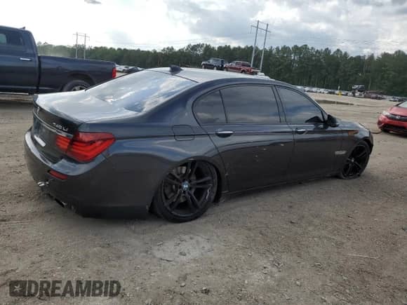 2014 BMW 7 Series 740Li with VIN WBAYE4C52ED137991, listed as a Copart auction lot 54702135 with 145,375 mi miles and Salvage title. Bid and sale history available at DreamBid. Image 3.