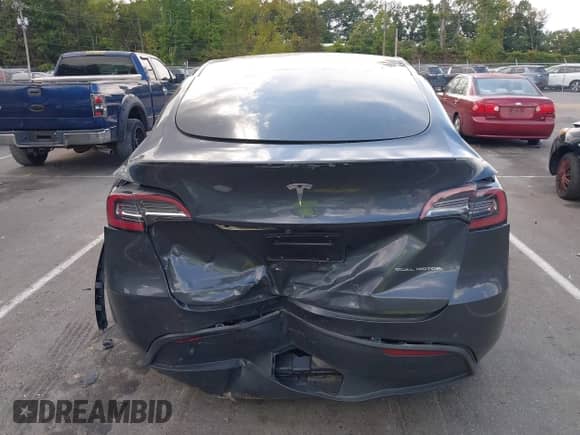 2021 Tesla Model Y Long Range with VIN 5YJYGAEE6MF251590, listed as a IAAI auction lot 43066576 with 33,937 mi miles and . Bid and sale history available at DreamBid. Image 16.