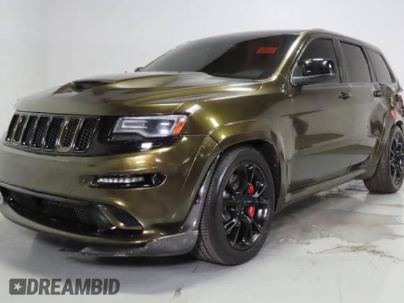 2014 Jeep Grand Cherokee SRT-8 z VIN 1C4RJFDJ9EC389009, wystawiony jako Copart lot #86140085 z przebiegiem 128 339 mil mil oraz Szkoda całkowita • Salvage title. Historia ofert i sprzedaży dostępna na DreamBid. Obrazek 2.