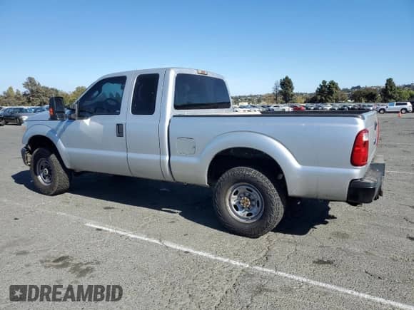 2015 Ford F-250 XLT with VIN 1FT7X2B69FEC27156, listed as a Copart auction lot 71694195 with 228,807 mi miles and Salvage title. Bid and sale history available at DreamBid. Image 2.