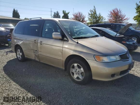 2000 Honda Odyssey EX with VIN 2HKRL1863YH571364, listed as a Copart auction lot 81698305 with 235,316 mi miles and Salvage title. Bid and sale history available at DreamBid. Image 4.