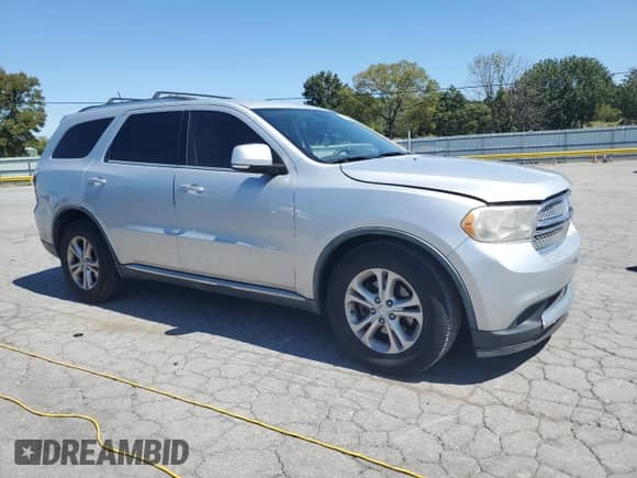 2012 Dodge Durango Crew with VIN 1C4RDHDG0CC158391, listed as a Copart auction lot 71516135 with 183,881 mi miles and Salvage title. Bid and sale history available at DreamBid. Image 4.