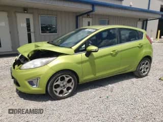 2011 Ford Fiesta SES with VIN 3FADP4FJ9BM186003, listed as a Copart auction lot 62401805 with 158,599 mi miles and Salvage title. Bid and sale history available at DreamBid. Image 1.