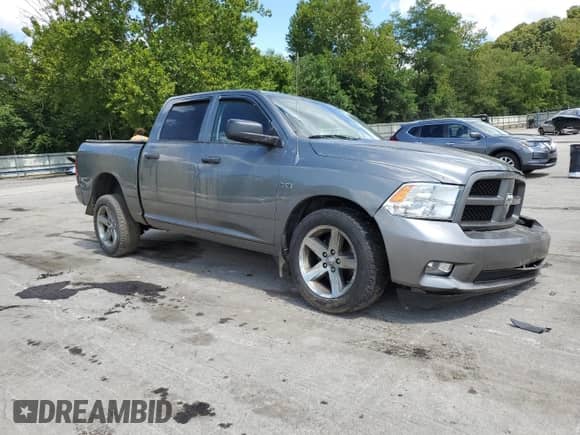 2012 Ram 1500 Express with VIN 1C6RD7KT0CS344844, listed as a Copart auction lot 70133435 with 159,568 mi miles and Salvage title. Bid and sale history available at DreamBid. Image 4.