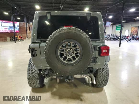 2023 Jeep Wrangler Rubicon 20th Anniversary with VIN 1C4JJXSJ1PW694740, listed as a Copart auction lot 45589135 with 16,498 mi miles and Salvage title. Bid and sale history available at DreamBid. Image 4.