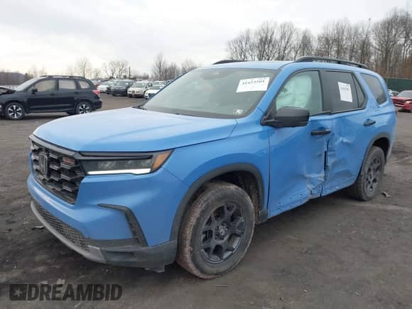 2023 Honda Pilot TrailSport with VIN 5FNYG1H61PB048082, listed as a IAAI auction lot 41653501 with 37,709 mi miles and . Bid and sale history available at DreamBid. Image 2.