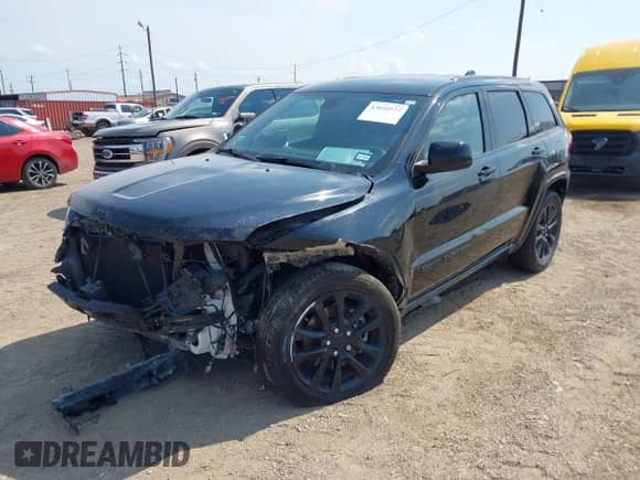 2021 Jeep Grand Cherokee Laredo E with VIN 1C4RJEAG8MC596881, listed as a IAAI auction lot 43050572 with 70,902 mi miles and . Bid and sale history available at DreamBid. Image 18.