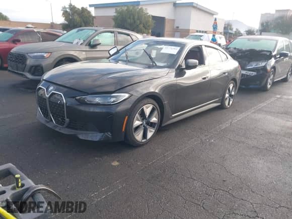 2023 BMW i4 eDrive35 with VIN WBY43AW02PFP50656, listed as a IAAI auction lot 41776504 with 18,024 mi miles and . Bid and sale history available at DreamBid. Image 2.