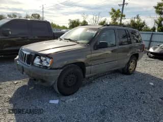2002 Jeep Grand Cherokee Laredo with VIN 1J4GX48SX2C277919, listed as a Copart auction lot 70095375 with 215,371 mi miles and Salvage title. Bid and sale history available at DreamBid. Image 1.