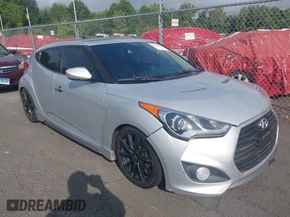2014 Hyundai Veloster Turbo with VIN KMHTC6AE8EU211248, listed as a IAAI auction lot 43078232 with 184,148 mi miles and . Bid and sale history available at DreamBid. Image 1.