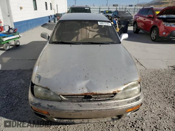 1995 Toyota Camry LE z VIN JT2GK12E9S0111987, wystawiony jako Copart lot #68873785 z przebiegiem 321 898 mil mil oraz Czysty tytuł • Clean title. Historia ofert i sprzedaży dostępna na DreamBid. Obrazek 5.