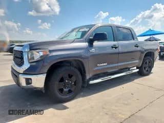 2020 Toyota Tundra SR5 with VIN 5TFEY5F11LX257773, listed as a Copart auction lot 82179675 with 105,063 mi miles and Salvage title. Bid and sale history available at DreamBid. Image 1.