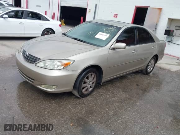 2003 Toyota Camry XLE with VIN 4T1BE32K93U753660, listed as a IAAI auction lot 43323226 with 194,495 mi miles and . Bid and sale history available at DreamBid. Image 2.