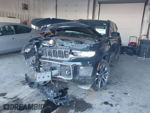 2023 Jeep Grand Cherokee Overland z VIN 1C4RJHDG5PC507978, wystawiony jako IAAI lot #41394199 z przebiegiem 57 323 mil mil oraz . Historia ofert i sprzedaży dostępna na DreamBid. Obrazek 2.