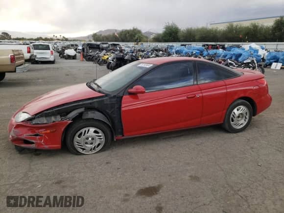 2001 Saturn SC with VIN 1G8ZY12701Z201761, listed as a Copart auction lot 76792804 with 85,352 mi miles and Salvage title. Bid and sale history available at DreamBid. Image 1.