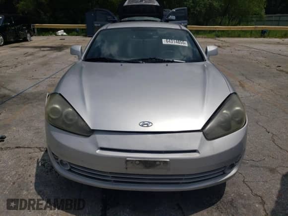 2007 Hyundai Tiburon GS z VIN KMHHM66D47U257018, wystawiony jako Copart lot #64314855 z przebiegiem 183 370 mil mil oraz Szkoda całkowita • Salvage title. Historia ofert i sprzedaży dostępna na DreamBid. Obrazek 5.