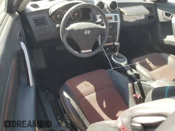 2006 Hyundai Tiburon GT z VIN KMHHN65F76U190851, wystawiony jako Copart lot #45935795 z przebiegiem 102 335 mil mil oraz Szkoda całkowita • Salvage title. Historia ofert i sprzedaży dostępna na DreamBid. Obrazek 8.