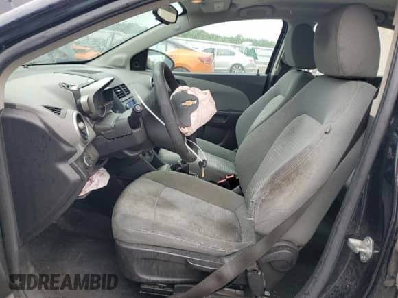 2015 Chevrolet Sonic LS with VIN 1G1JB5SG0F4210338, listed as a Copart auction lot 63960604 with 210,499 mi miles and Salvage title. Bid and sale history available at DreamBid. Image 7.