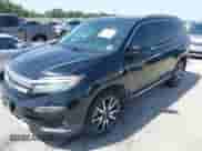 2021 Honda Pilot Elite with VIN 5FNYF6H02MB079610, listed as a IAAI auction lot 42309677 with 51,451 mi miles and . Bid and sale history available at DreamBid. Image 2.