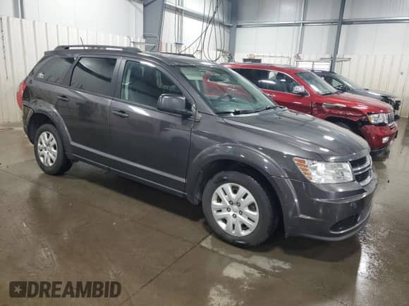 2016 Dodge Journey SE z VIN 3C4PDCAB9GT186896, wystawiony jako Copart lot #66667785 z przebiegiem 202 884 mil mil oraz Szkoda całkowita • Salvage title. Historia ofert i sprzedaży dostępna na DreamBid. Obrazek 4.