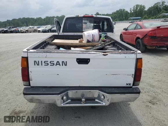 1996 Nissan Frontier XE with VIN 1N6SD16S6TC389626, listed as a Copart auction lot 59312595 with 210,292 mi miles and Salvage title. Bid and sale history available at DreamBid. Image 6.