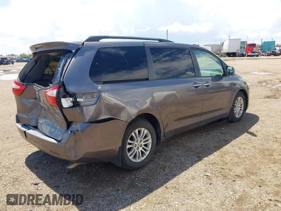 2015 Toyota Sienna XLE with VIN 5TDYK3DC7FS662215, listed as a IAAI auction lot 43208864 with 142,089 mi miles and . Bid and sale history available at DreamBid. Image 4.