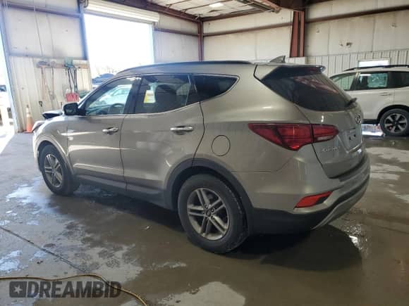2017 Hyundai Santa Fe 2.4L z VIN 5NMZUDLB0HH012693, wystawiony jako Copart lot #85827455 z przebiegiem 139 188 mil mil oraz Szkoda całkowita • Salvage title. Historia ofert i sprzedaży dostępna na DreamBid. Obrazek 2.