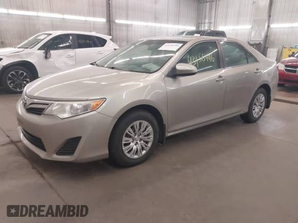 2014 Toyota Camry LE with VIN 4T4BF1FK0ER407002, listed as a IAAI auction lot 43156496 with 107,232 mi miles and . Bid and sale history available at DreamBid. Image 2.