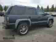 2004 Chevrolet Tahoe LT с VIN 1GNEC13T74R276242, выставлен на аукционе Copart как лот 70556415 с пробегом 177 615 миль миль и Списание • Salvage title. История ставок и продаж доступна на DreamBid. Изображение 3.