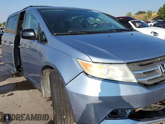 2013 Honda Odyssey EX-L z VIN 5FNRL5H63DB030895, wystawiony jako Copart lot #71099185 z przebiegiem 200 959 mil mil oraz Szkoda całkowita • Salvage title. Historia ofert i sprzedaży dostępna na DreamBid. Obrazek 13.