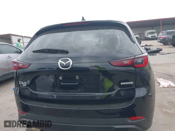 2023 Mazda CX-5 S Carbon Edition z VIN JM3KFBCM8P0202054, wystawiony jako IAAI lot #42392586 z przebiegiem 50 944 mil mil oraz . Historia ofert i sprzedaży dostępna na DreamBid. Obrazek 16.