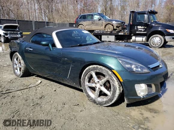 2007 Saturn Sky Red Line with VIN 1G8MG35X57Y131127, listed as a Copart auction lot 49488585 with 142,229 mi miles and Salvage title. Bid and sale history available at DreamBid. Image 4.