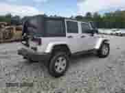 2007 Jeep Wrangler Unlimited Sahara z VIN 1J8GA59117L147997, wystawiony jako Copart lot #80804505 z przebiegiem 173 107 mil mil oraz Szkoda całkowita • Salvage title. Historia ofert i sprzedaży dostępna na DreamBid. Obrazek 3.