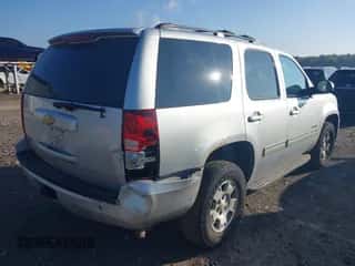 2013 Chevrolet Tahoe LS with VIN 1GNSKAE02DR285441, listed as a IAAI auction lot 43303869 with 230,513 mi miles and . Bid and sale history available at DreamBid. Image 4.