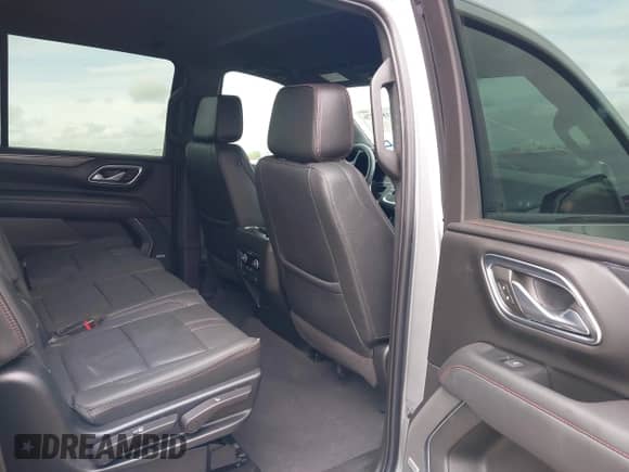 2023 Chevrolet Suburban RST with VIN 1GNSKEKD7PR329839, listed as a IAAI auction lot 41899376 with 47,444 mi miles and . Bid and sale history available at DreamBid. Image 8.