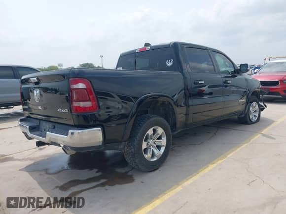 2021 Ram 1500 Laramie with VIN 1C6SRFJTXMN751178, listed as a IAAI auction lot 41802863 with 86,251 mi miles and . Bid and sale history available at DreamBid. Image 4.