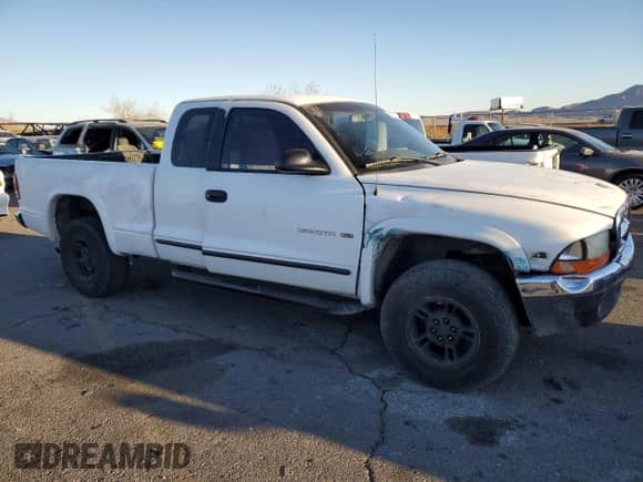 1998 Dodge Dakota SLT z VIN 1B7GG22Y1WS544271, wystawiony jako Copart lot #88781885 z przebiegiem 149 417 mil mil oraz Szkoda całkowita • Salvage title. Historia ofert i sprzedaży dostępna na DreamBid. Obrazek 4.