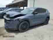 2022 Mazda CX-5 S Carbon Edition z VIN JM3KFBCM3N0576228, wystawiony jako Copart lot #63972945 z przebiegiem 63 644 mil mil oraz Nie do naprawy • Non repairable. Historia ofert i sprzedaży dostępna na DreamBid. Obrazek 1.